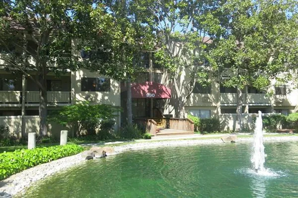 a swimming pool with outdoor seating and yard