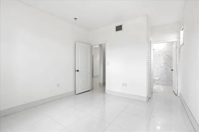 a bathroom with a toilet sink and a shower