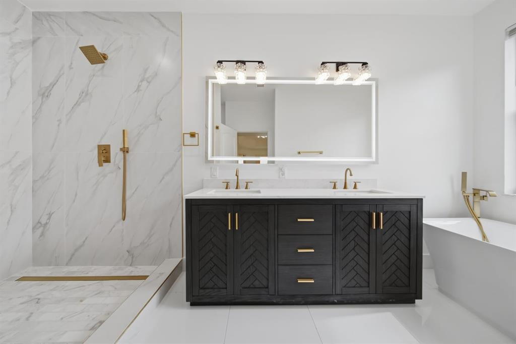 3802 Southwest 165th Terrace Miramar, FL 33027 - Photo 26 of 49 a bathroom with a sink vanity and mirror