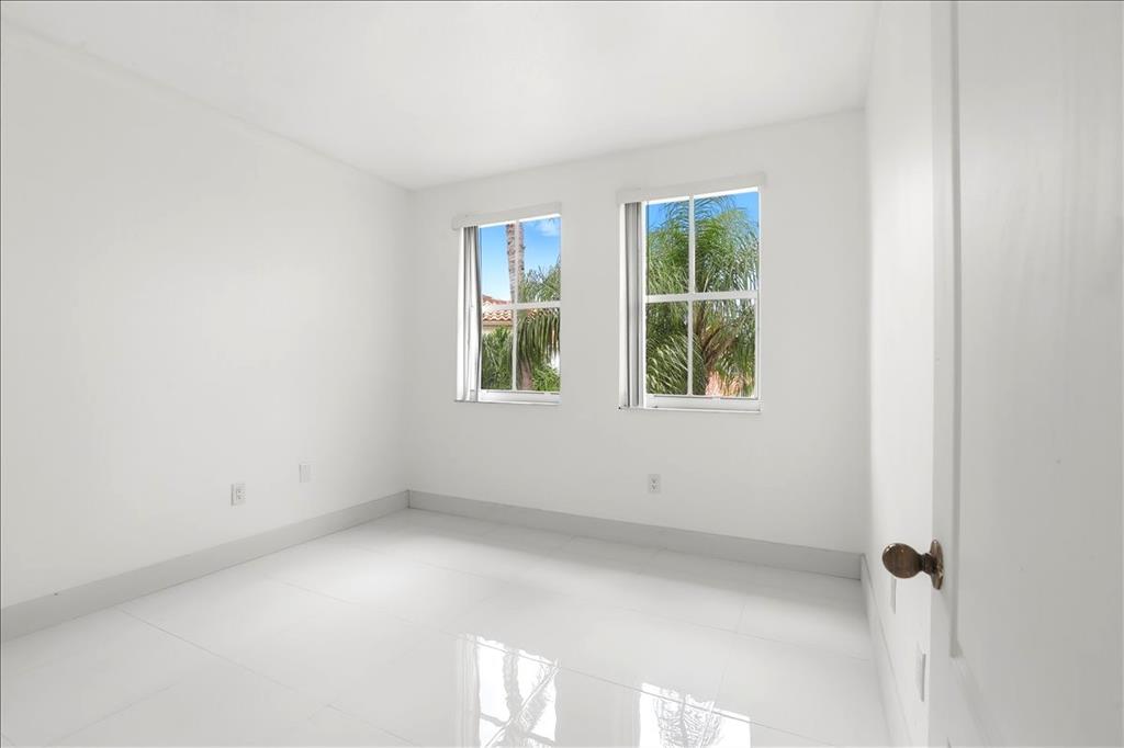 3802 Southwest 165th Terrace Miramar, FL 33027 - Photo 28 of 49 a view of an empty room with a window