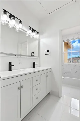 a bathroom with a sink a toilet and a bathtub