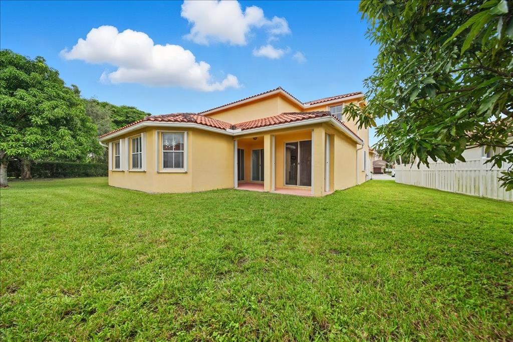 3802 Southwest 165th Terrace Miramar, FL 33027 - Photo 42 of 49 a view of a house with a backyard