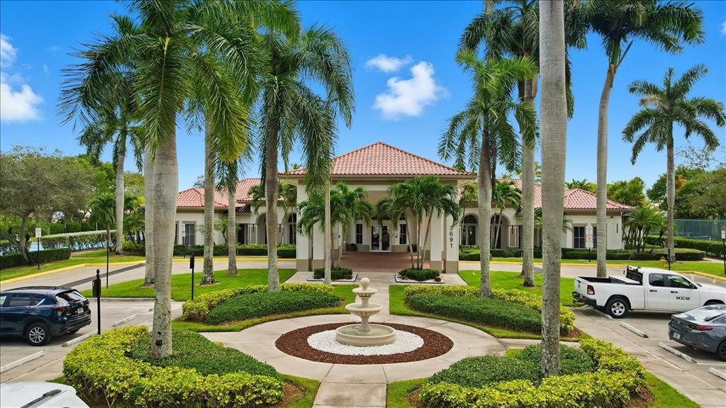 3802 Southwest 165th Terrace Miramar, FL 33027 - Photo 46 of 49 a view of a table and chairs in patio with a swimming pool