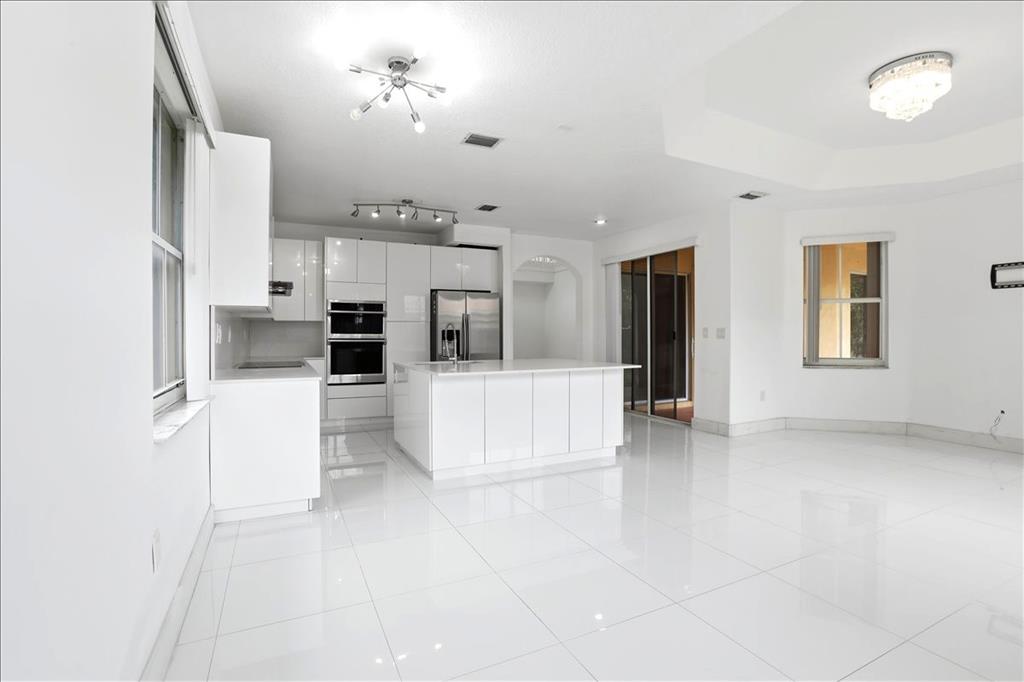 3802 Southwest 165th Terrace Miramar, FL 33027 - Photo 8 of 49 a view of kitchen with cabinets and refrigerator
