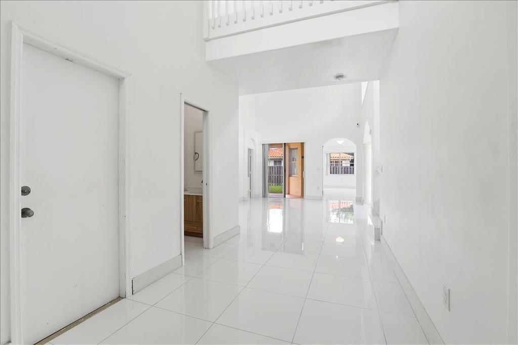 3802 Southwest 165th Terrace Miramar, FL 33027 - Photo 10 of 49 a view of an entryway with wooden floor