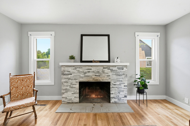 778 East 200 North Logan, UT 84321 - Photo 35 of 43 Stacked stone fireplace with a light-colored mantel