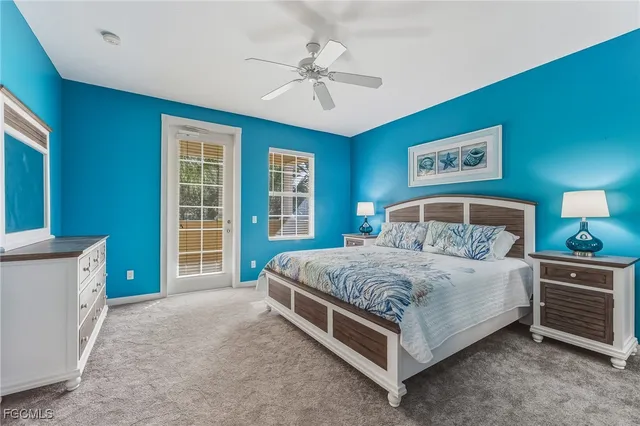 a spacious bedroom with a bed and a table