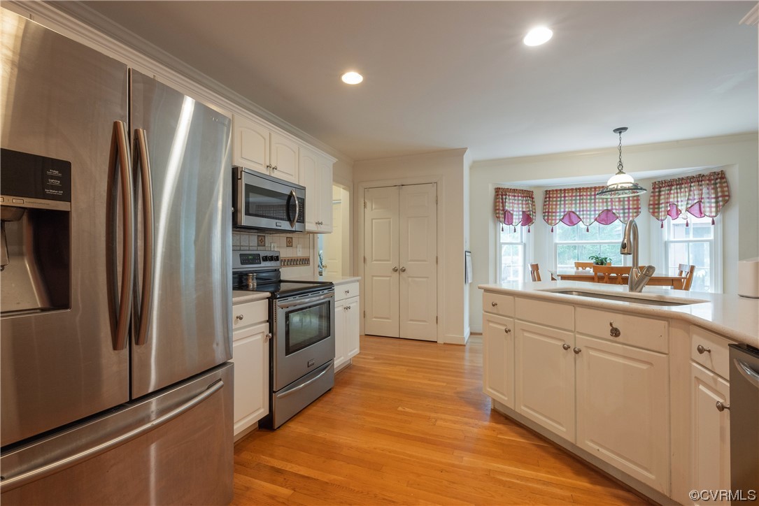 3530 Timberview Road Powhatan, VA 23139 - Photo 11 of 50 a kitchen with stainless steel appliances a refrigerator sink and microwave