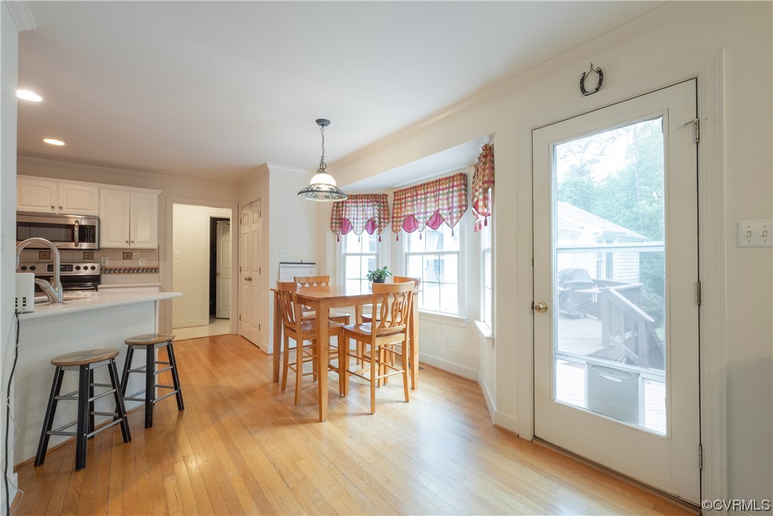 3530 Timberview Road Powhatan, VA 23139 - Photo 13 of 50 a view of a dining room with furniture and wooden floor
