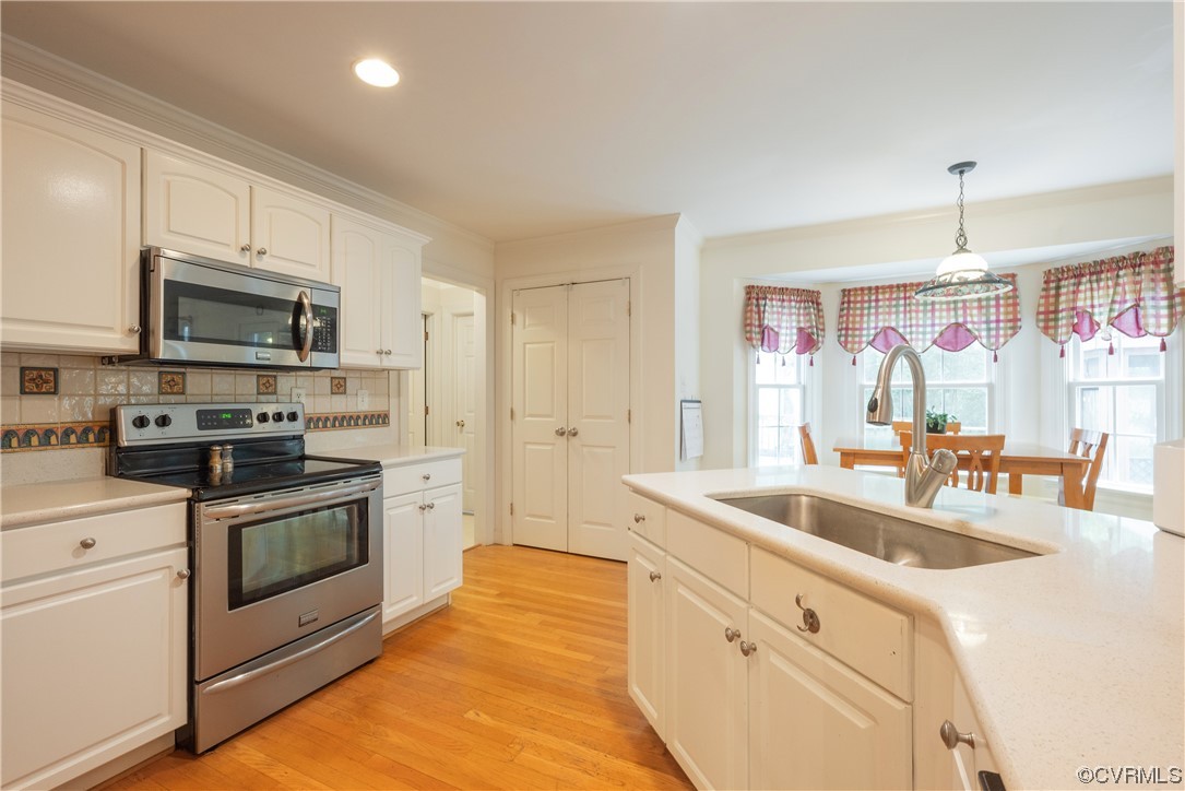 3530 Timberview Road Powhatan, VA 23139 - Photo 15 of 50 a kitchen with stainless steel appliances granite countertop a sink a stove and a refrigerator