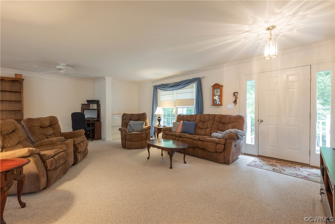 3530 Timberview Road Powhatan, VA 23139 - Photo 32 of 50 a living room with furniture and a chandelier