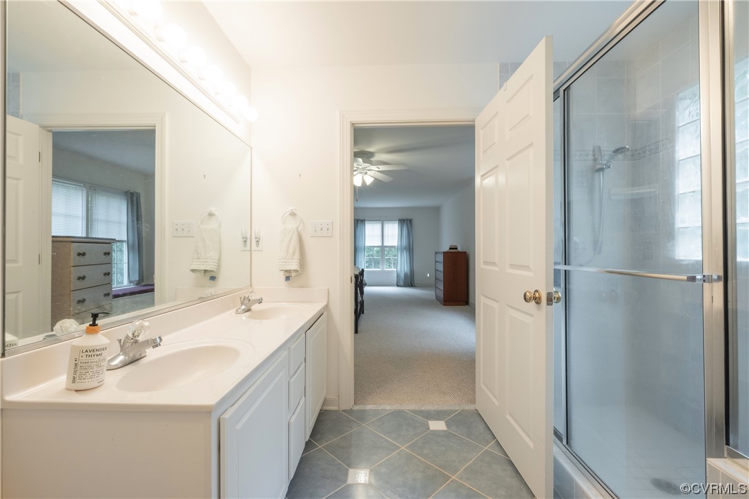 3530 Timberview Road Powhatan, VA 23139 - Photo 37 of 50 a spacious bathroom with a double vanity sink a mirror and a shower
