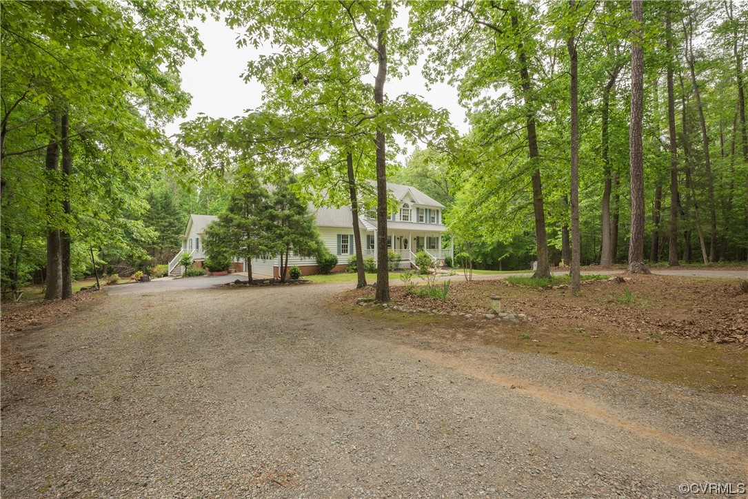 3530 Timberview Road Powhatan, VA 23139 - Photo 4 of 50 a view of a street with trees and bushes