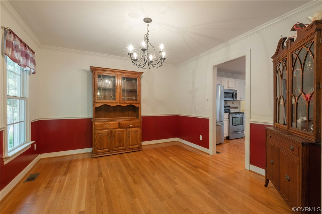 3530 Timberview Road Powhatan, VA 23139 - Photo 9 of 50 a living room with furniture and a wooden floor
