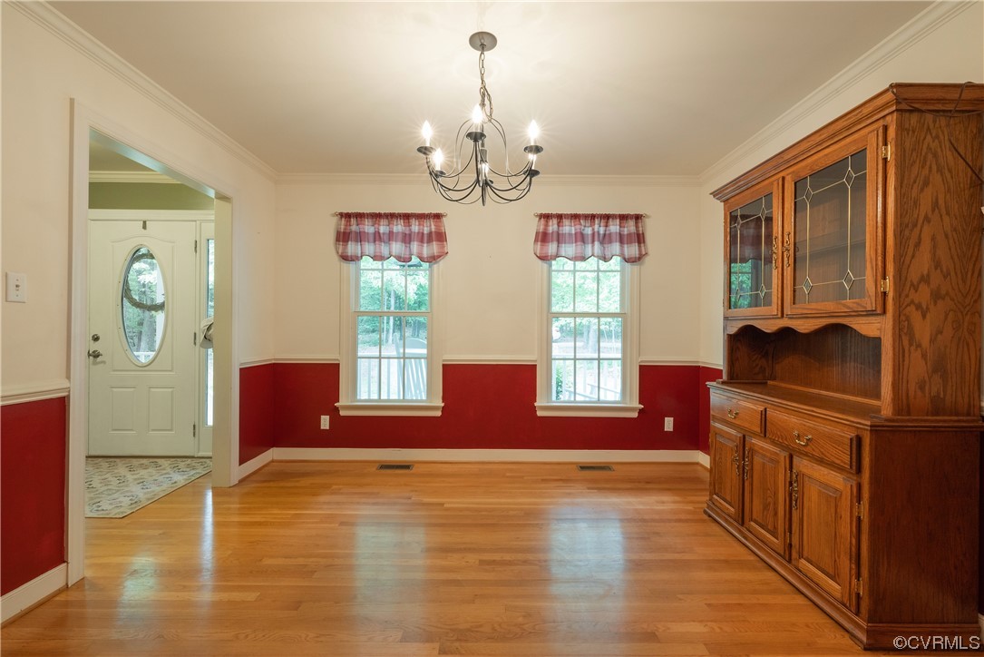 3530 Timberview Road Powhatan, VA 23139 - Photo 10 of 50 a living room with fireplace furniture and a chandelier