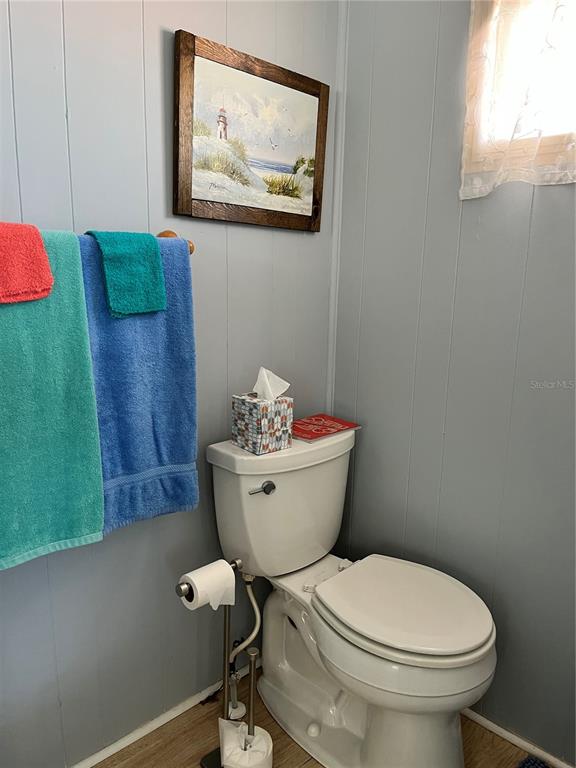 7254 Mt Fairfield Road Northeast, Unit 531 St. Petersburg, FL 33702 - Photo 12 of 19 a bathroom with a toilet and a sink