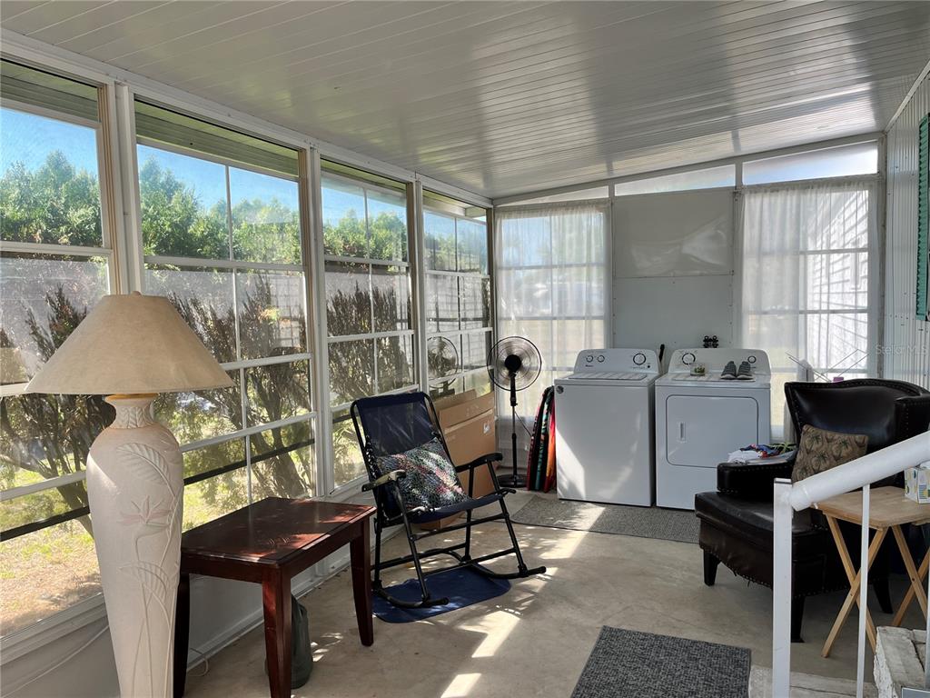 7254 Mt Fairfield Road Northeast, Unit 531 St. Petersburg, FL 33702 - Photo 2 of 19 a living room with furniture and a window