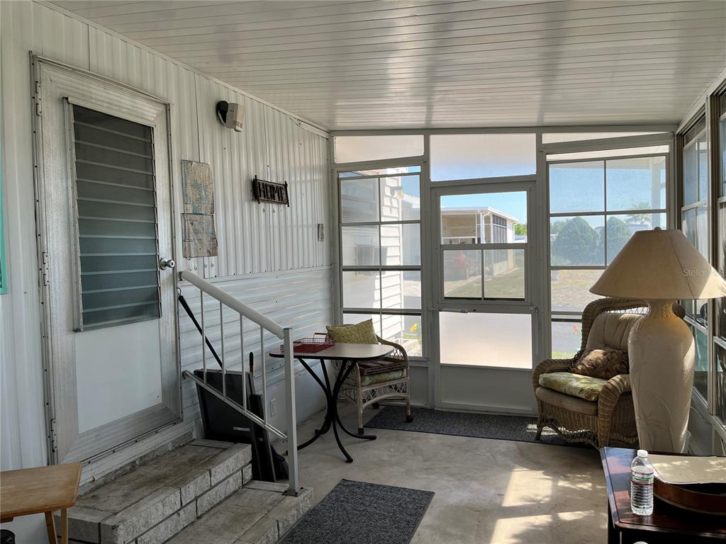 7254 Mt Fairfield Road Northeast, Unit 531 St. Petersburg, FL 33702 - Photo 3 of 19 a living room with furniture and a window