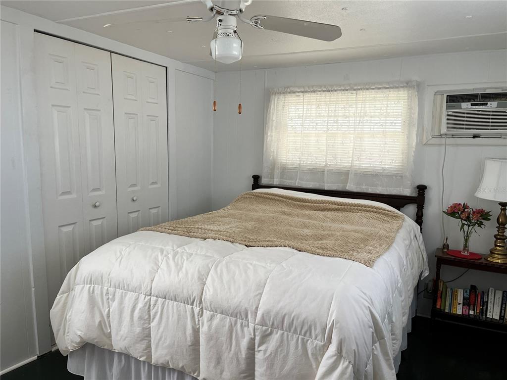 7254 Mt Fairfield Road Northeast, Unit 531 St. Petersburg, FL 33702 - Photo 8 of 19 a bedroom with a bed and a window