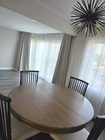 a view of a hallway to a livingroom and furniture
