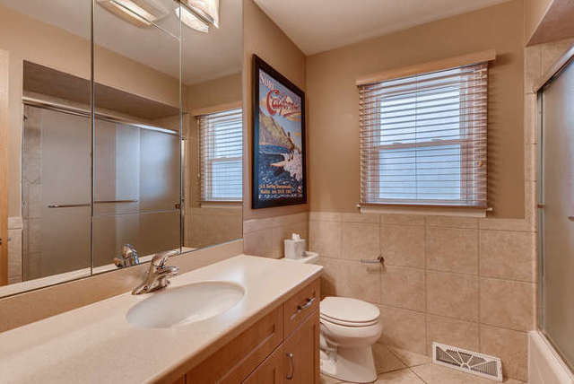 93 Ellendale Road Deerfield, IL 60015 - Photo 14 of 21 a bathroom with a sink toilet and shower