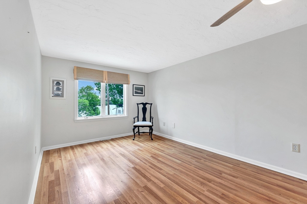 118 Woolford Road Wrentham, MA 02093 - Photo 31 of 41 wooden floor in an empty room with a window