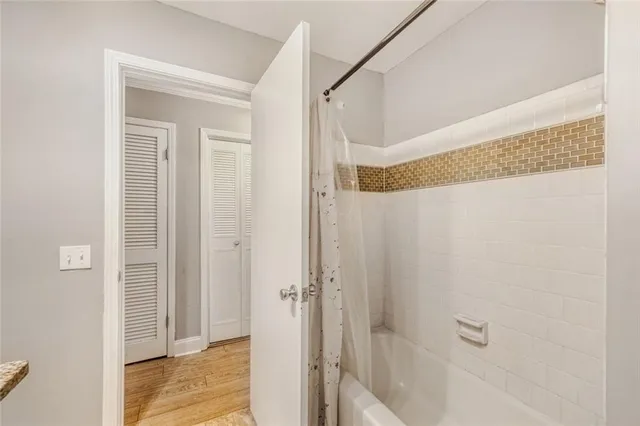 a bathroom with a glass shower door