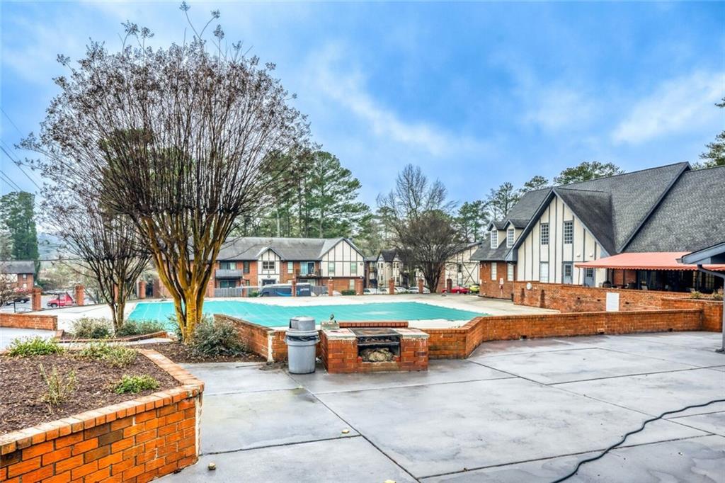 6851 Roswell Road, Unit A5 Atlanta, GA 30328 - Photo 25 of 35 a view of a house with outdoor space and sitting area