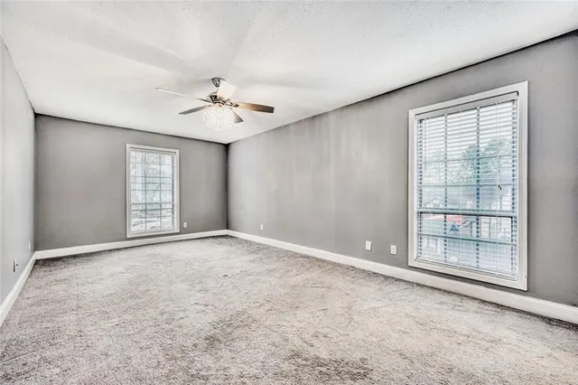 a view of an empty room with a fireplace