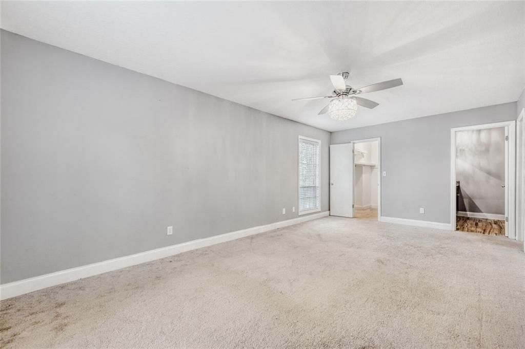 6851 Roswell Road, Unit A5 Atlanta, GA 30328 - Photo 33 of 35 a view of an empty room with a fireplace