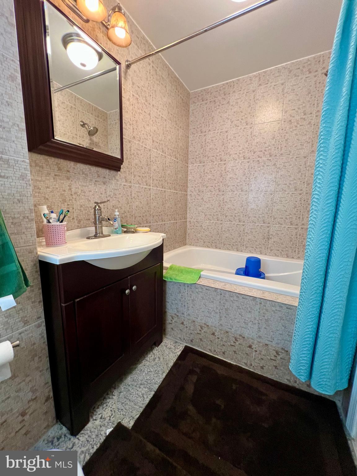 2988 Welsh Road Philadelphia, PA 19152 - Photo 18 of 38 a bathroom with a sink and a mirror