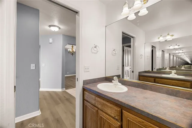 a kitchen with granite countertop cabinets washer and dryer
