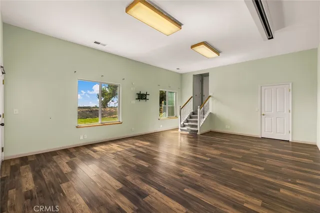 a view of hallway with wooden floor