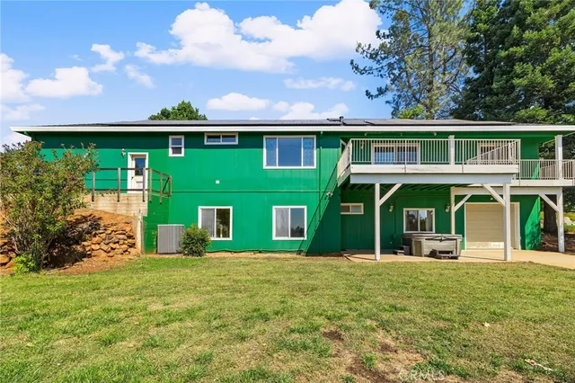 an aerial view of house with yard