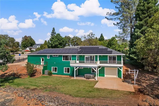 an aerial view of residential building and trees around