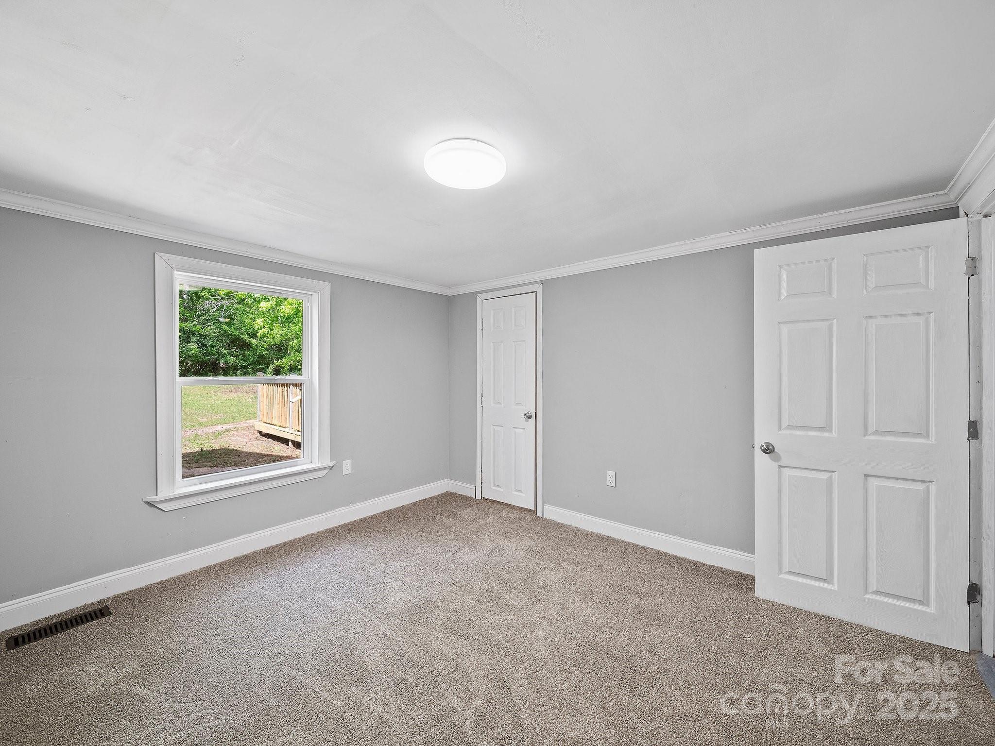 308 Miller Street, Unit 1 Jefferson, SC 29718 - Photo 19 of 44 a view of an empty room with a window