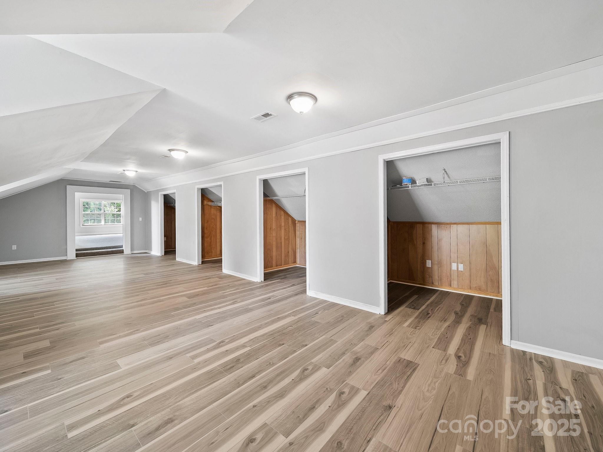308 Miller Street, Unit 1 Jefferson, SC 29718 - Photo 39 of 44 wooden floor in an empty room with a window
