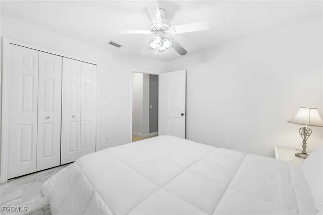 a bedroom with a bed and a table