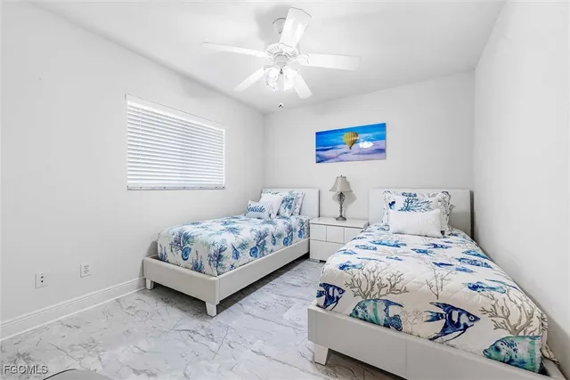 a bedroom with bed and a window