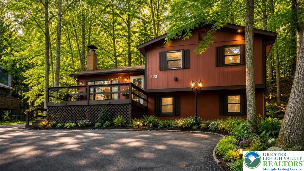 6061 Decker Road Bushkill, PA 18324 - Photo 1 of 27 a front view of a house with garden