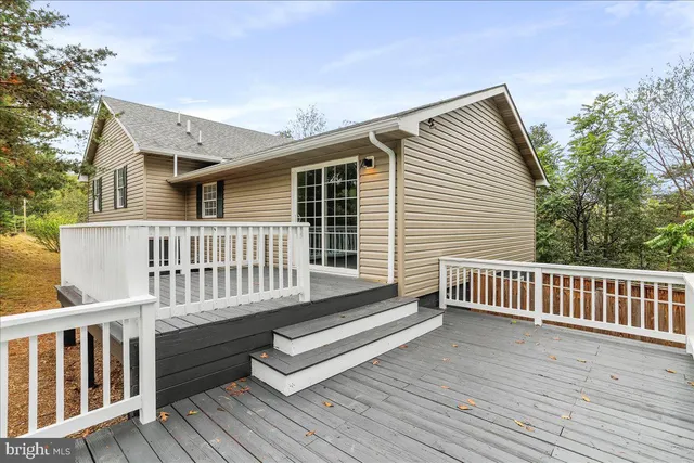 a view of a wooden chairs on deck