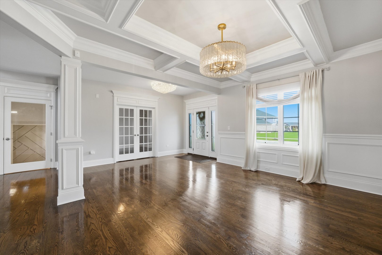 8613 High Stone Way Frankfort, IL 60423 - Photo 13 of 57 a view of an empty room with wooden floor and a window