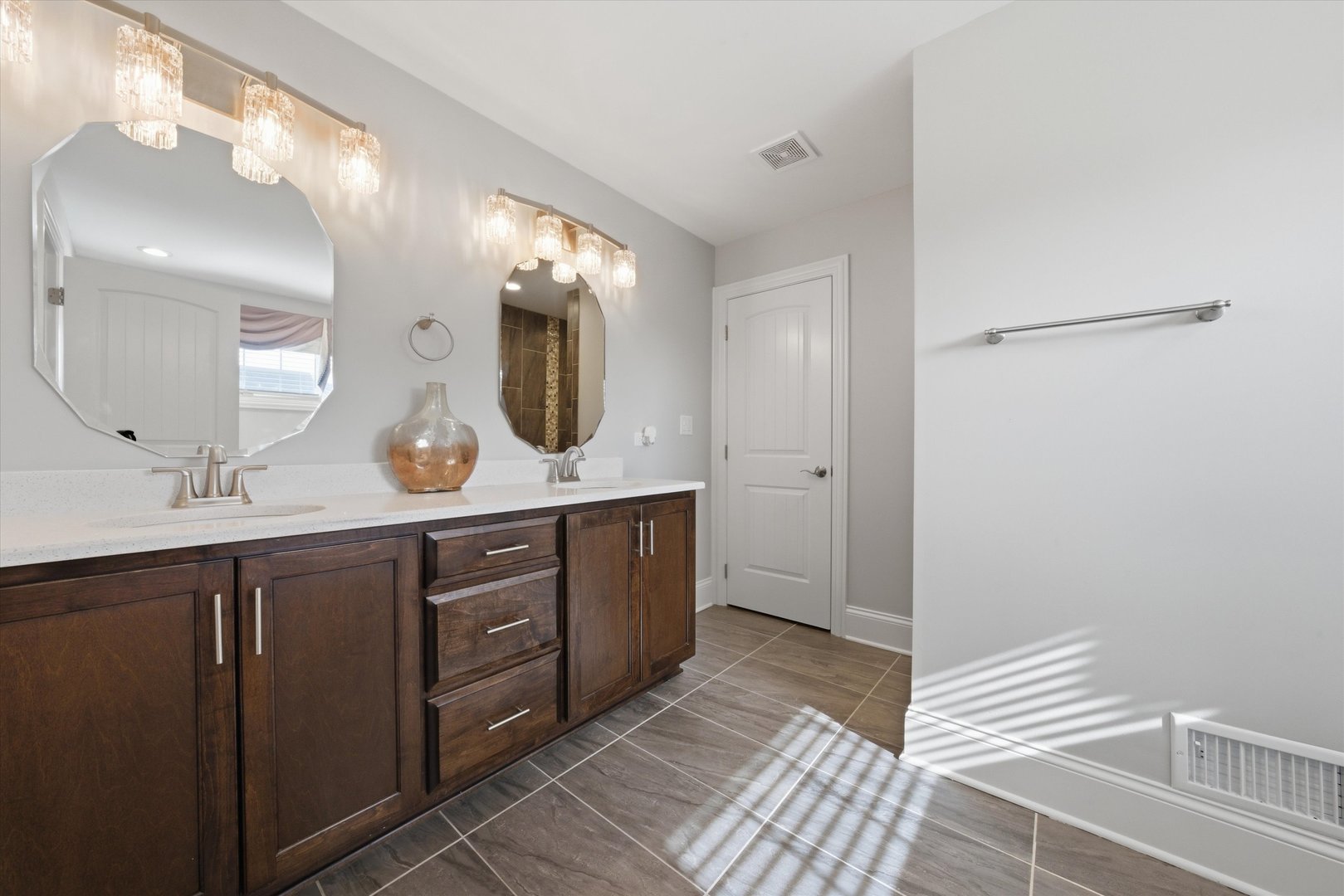 8613 High Stone Way Frankfort, IL 60423 - Photo 27 of 57 a spacious bathroom with a double vanity sink and a mirror