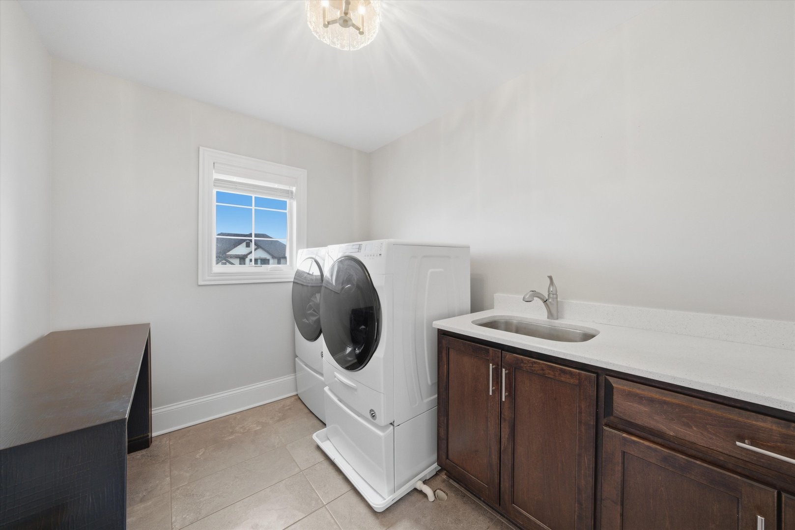 8613 High Stone Way Frankfort, IL 60423 - Photo 31 of 57 a utility room with cabinets washer and dryer