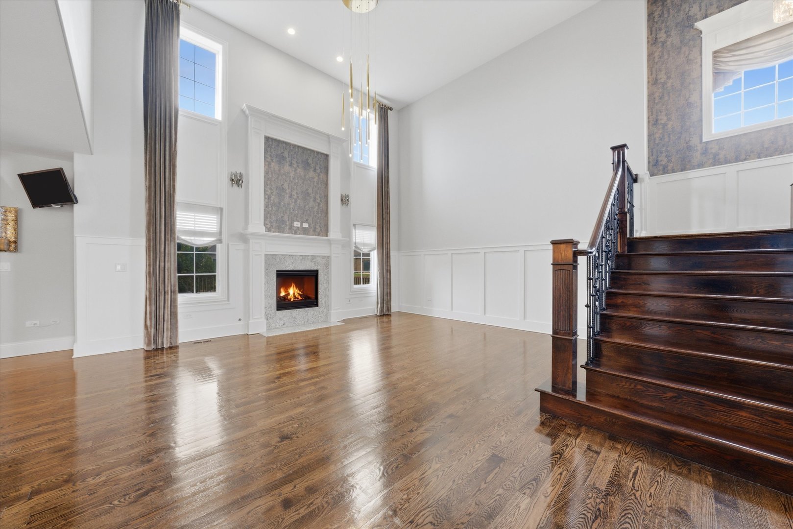 8613 High Stone Way Frankfort, IL 60423 - Photo 9 of 57 a view of an empty room with wooden floor fireplace and a window