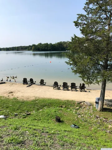 a view of a lake with a big yard