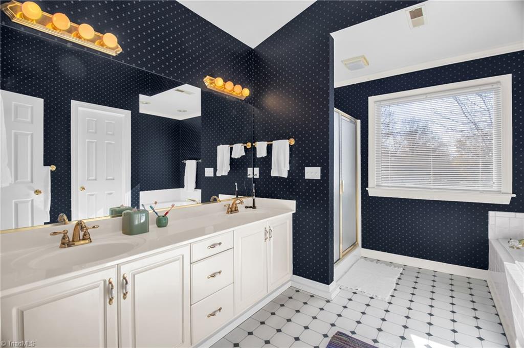 8115 Glengarriff Road Clemmons, NC 27012 - Photo 29 of 47 Primary bathroom offers great space - tub and separate shower