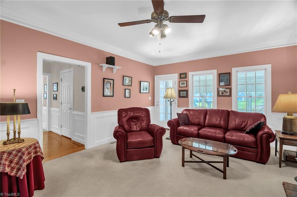 8115 Glengarriff Road Clemmons, NC 27012 - Photo 7 of 47 Door to hallway to Kitchen, Powder Room and adjoins Sunroom