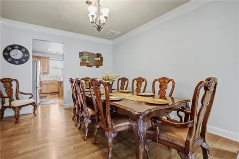 a kitchen with granite countertop cabinets stainless steel appliances a sink and window