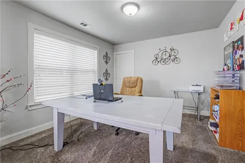a bedroom with bed and a couch